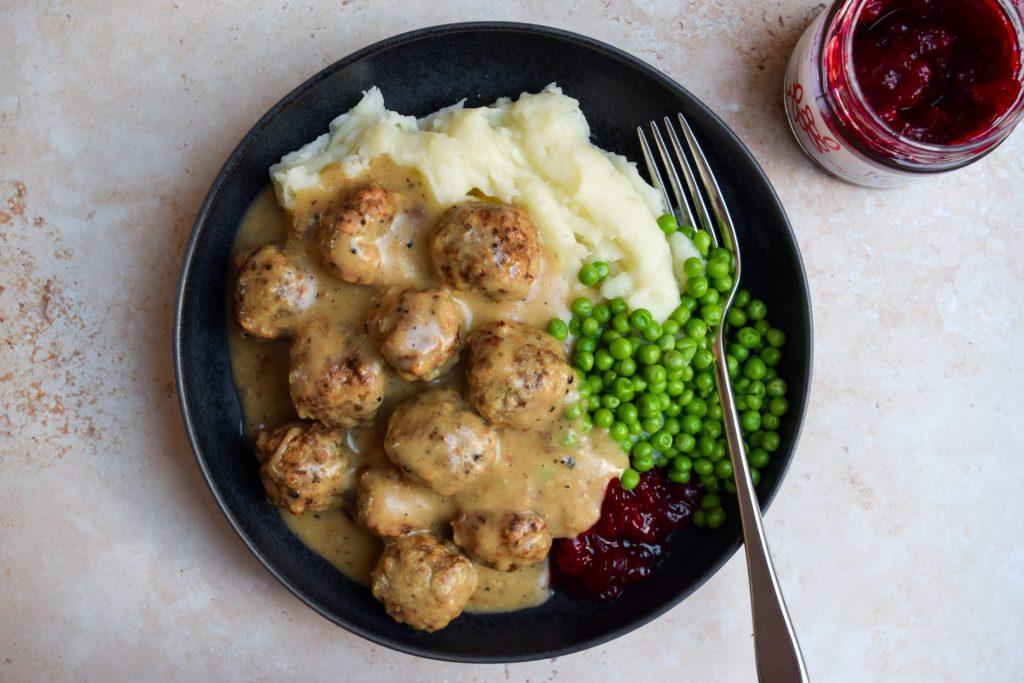 Creamy skillet of Swedish meatballs studded with sweet tender green peas and fresh dill
