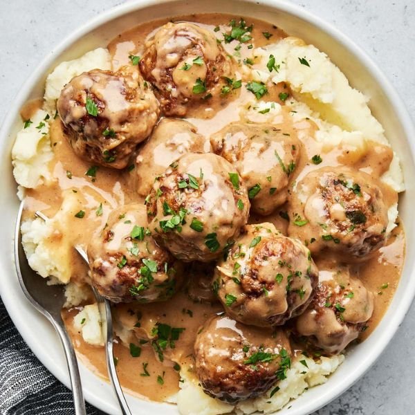 Quick 30-minute skillet of sizzling Swedish meatballs smothered in homemade creamy pan gravy