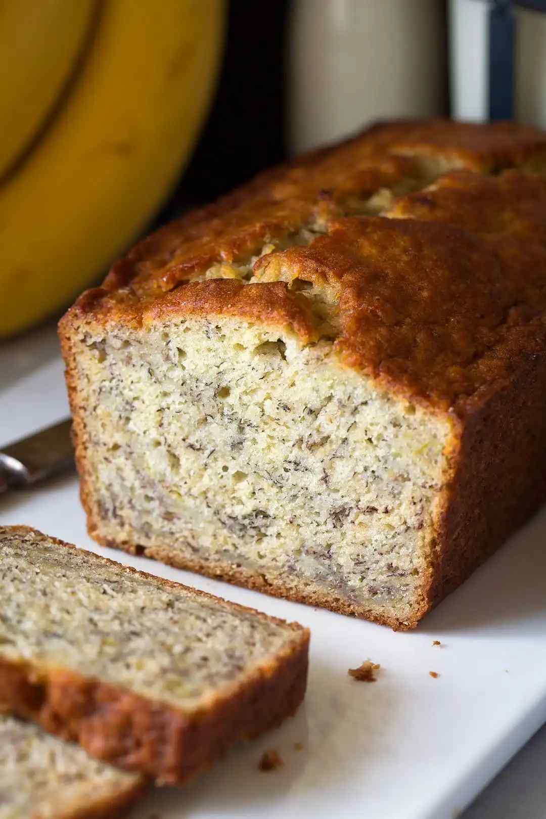 Golden crust, fluffy banana crumb, inviting aroma, classic banana bread slice