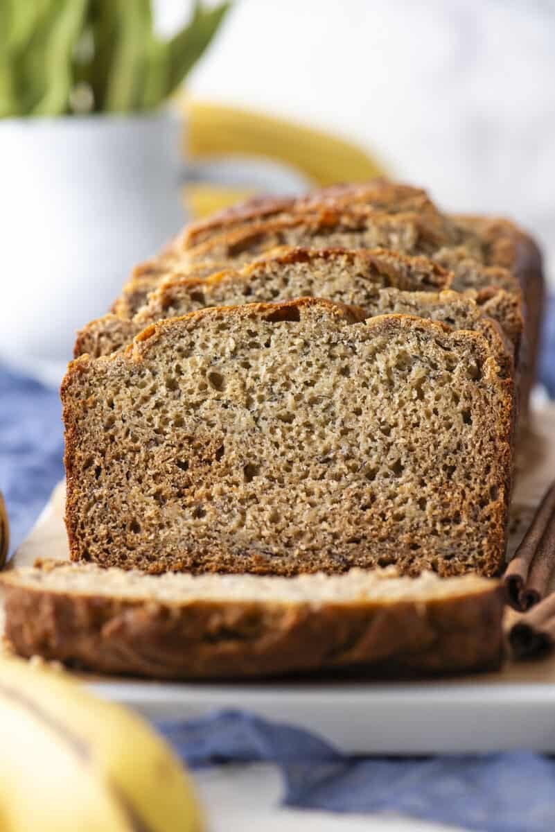 Golden banana loaf with a glossy crust, soft crumb, and pronounced banana aroma