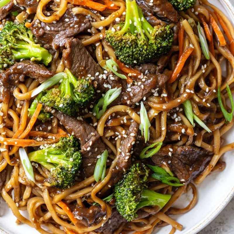 Savory beef and broccoli noodle bowl with tender beef, crisp broccoli, and glossy noodles in a savory sauce