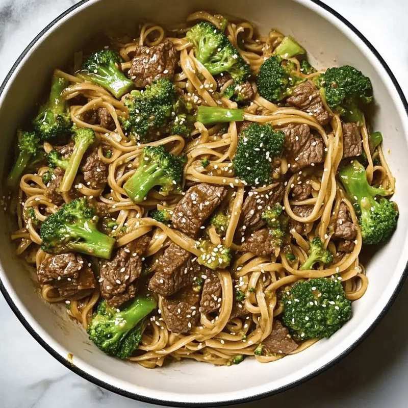 Garlic beef and broccoli noodles with tender beef, crisp broccoli, and fragrant garlic sauce