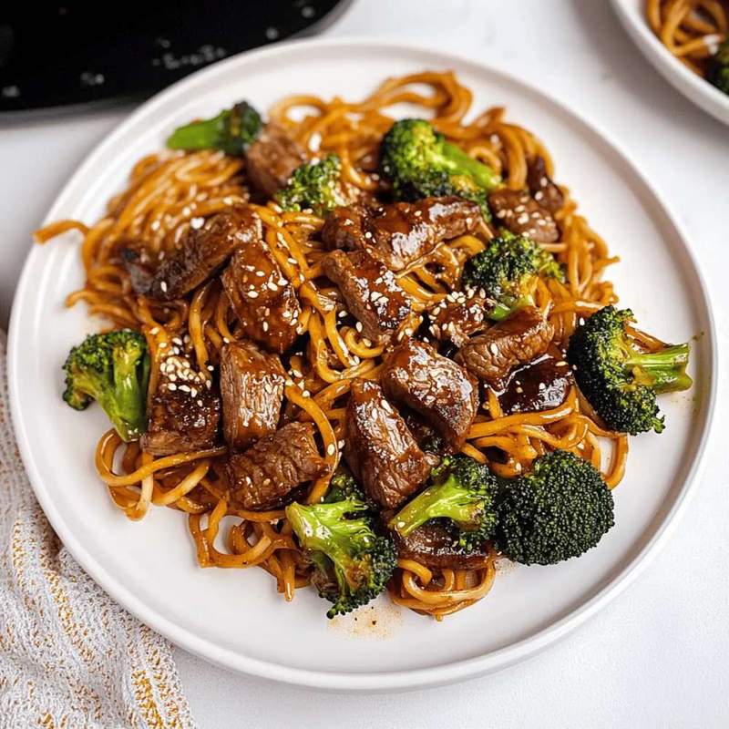 Beef and broccoli lo mein noodles with tender beef, crisp broccoli, and glossy sauce