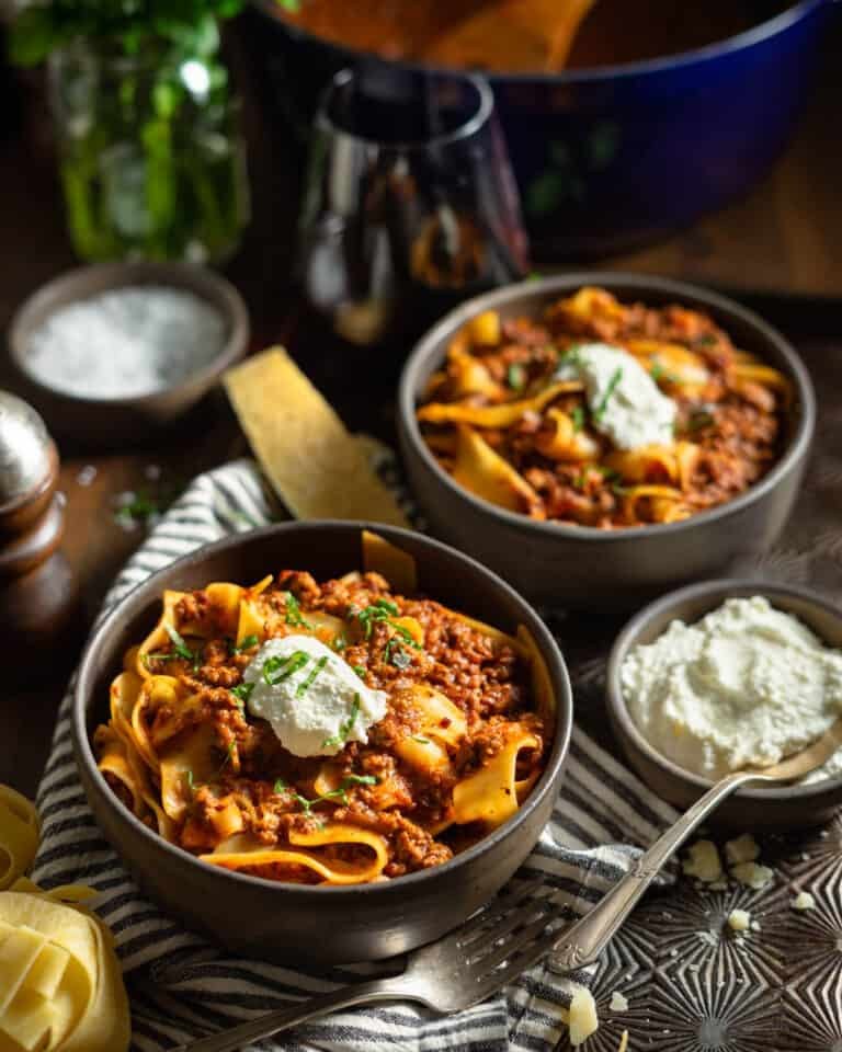 Creamy bolognese with beef, parmesan, fresh basil, rich tomato sauce, and pasta.