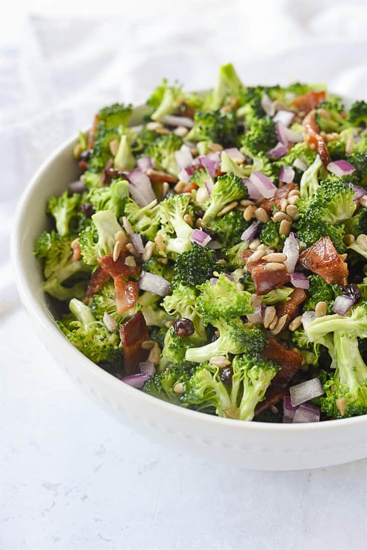 Classic broccoli salad with crisp florets, apple cider vinaigrette, pecans, golden raisins, mozzarella pearls