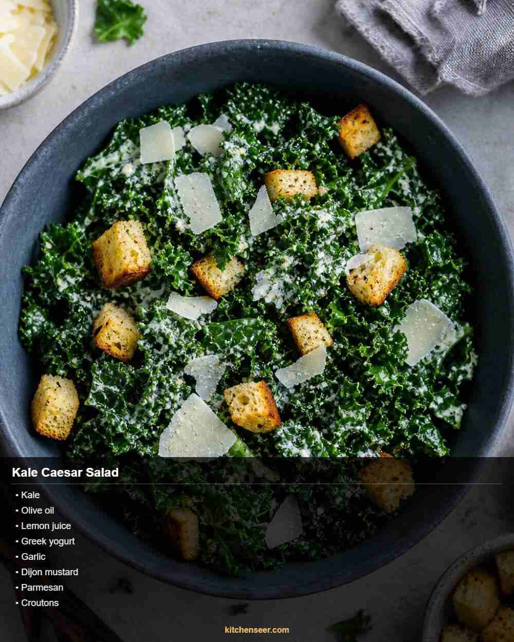 Healthy kale caesar salad with roasted crispy chickpeas dark leafy greens and shaved parmesan