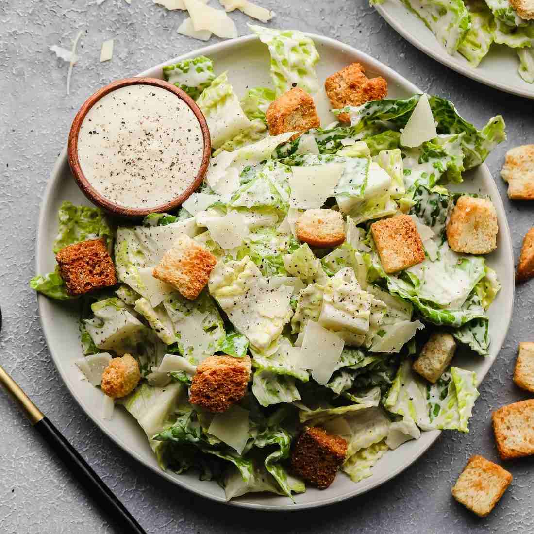 Classic caesar salad served with crisp romaine, crunchy croutons, shaved parmesan, and creamy dressing.
