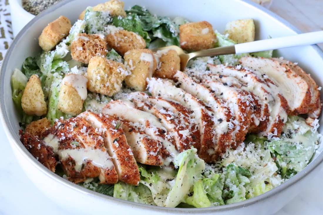 Spicy blackened chicken caesar salad with crisp romaine, crunchy croutons, shaved parmesan, and creamy dressing.