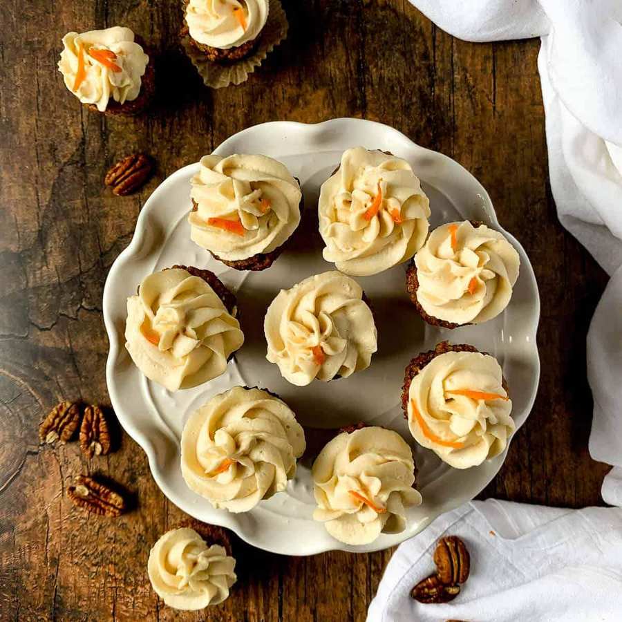 Mini gluten‑free carrot cake cupcakes with moist spiced crumb, cream cheese swirl, and chopped pecans