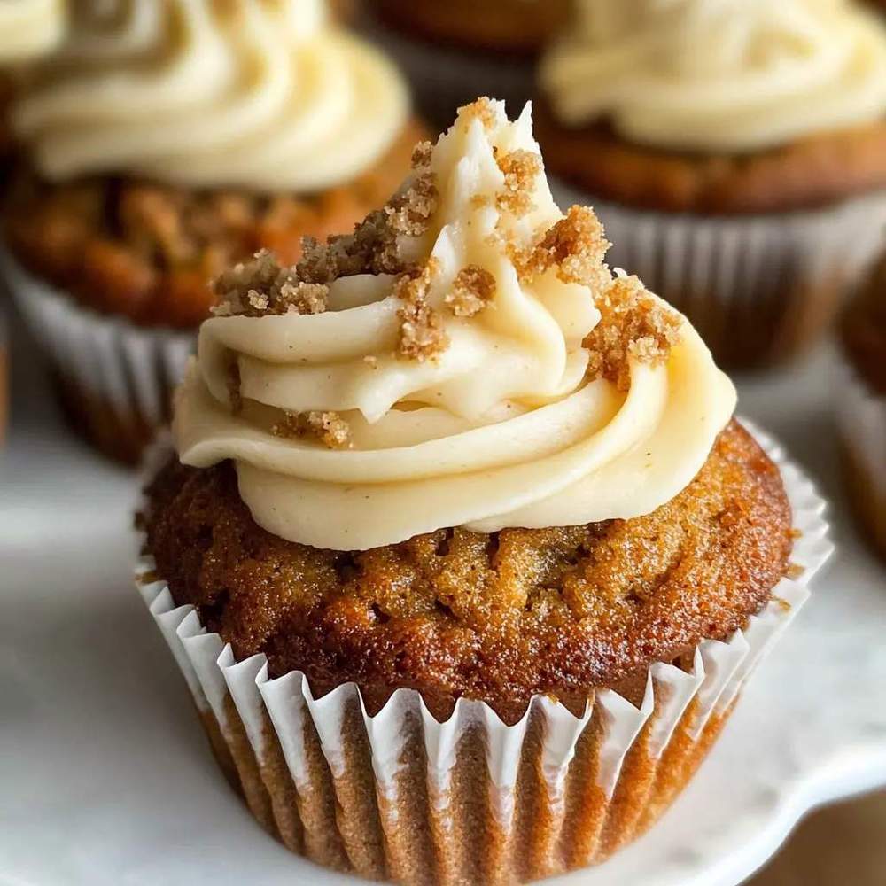 Small‑batch carrot cupcakes with rich chocolate‑swirl cream cheese frosting and toasted coconut flakes