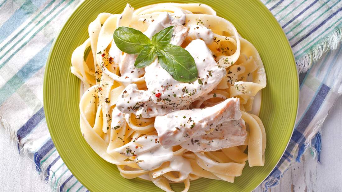 Creamy fettuccine chicken alfredo with tender grilled chicken, silky parmesan sauce, and golden pasta