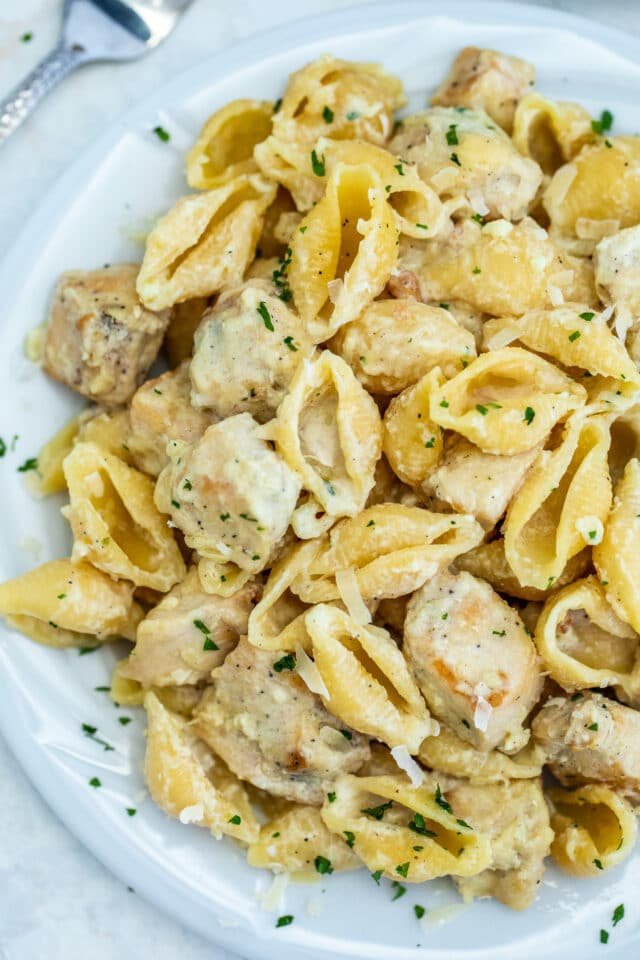 Classic fettuccine chicken alfredo featuring tender chicken and silky parmesan cream sauce, perfectly coated fettuccine