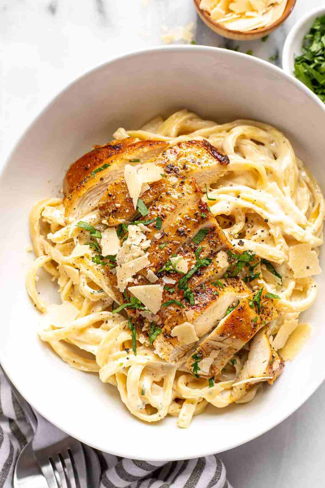 Classic fettuccine chicken alfredo with tender seasoned chicken and silky garlic parmesan cream sauce