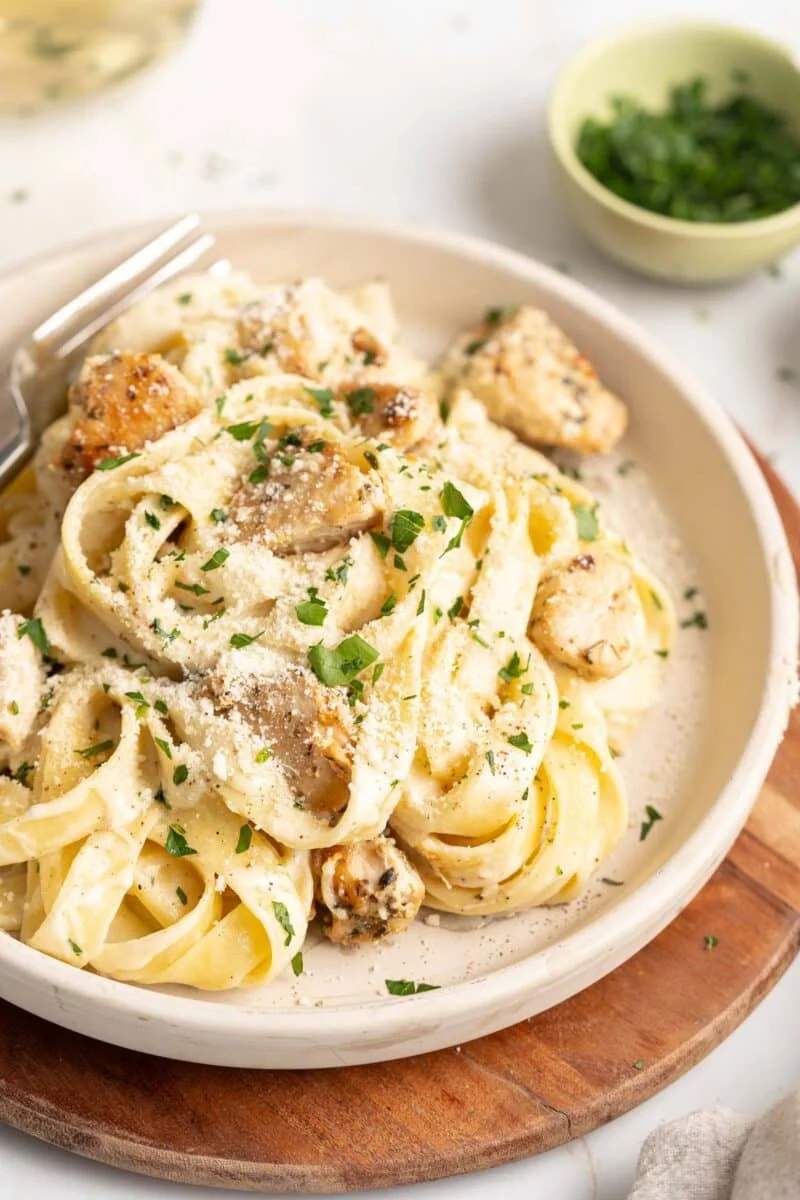 Homemade gluten-free chicken alfredo with tender chicken, silky parmesan cream sauce, and fettuccine.