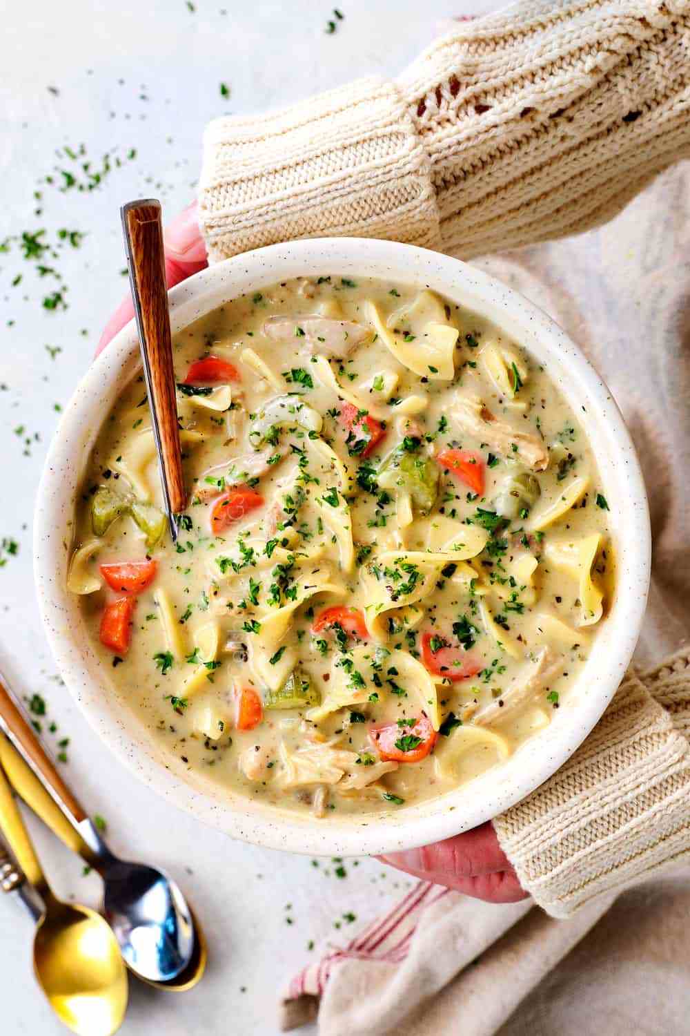 Creamy chicken pot pie soup with sweet‑potato biscuit topping, chicken, peas, carrots, potatoes
