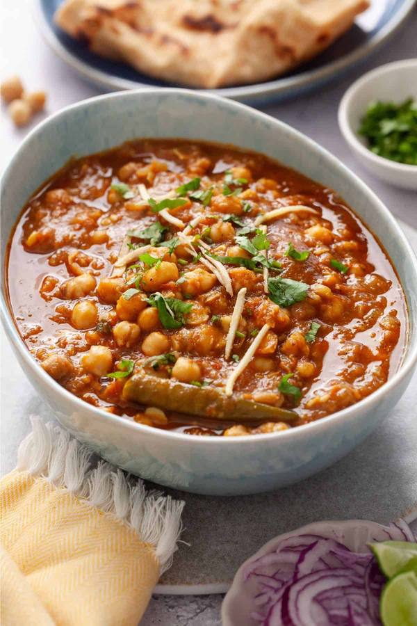 Creamy chickpea curry in golden cashew sauce with fragrant spices, cilantro, and fluffy basmati rice.