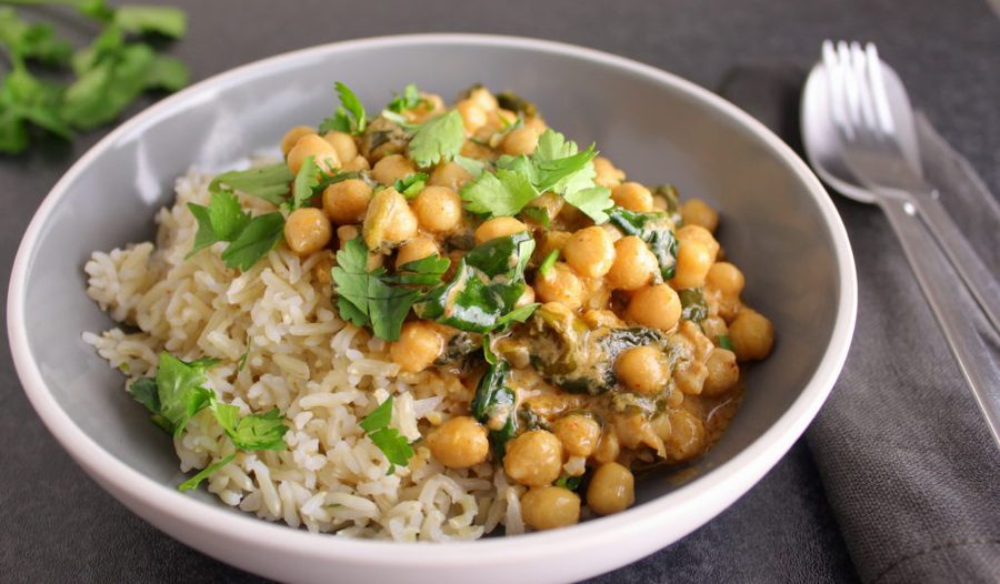 Zesty Thai red chickpea curry with kaffir lime leaves and tender wilted baby spinach over rice.