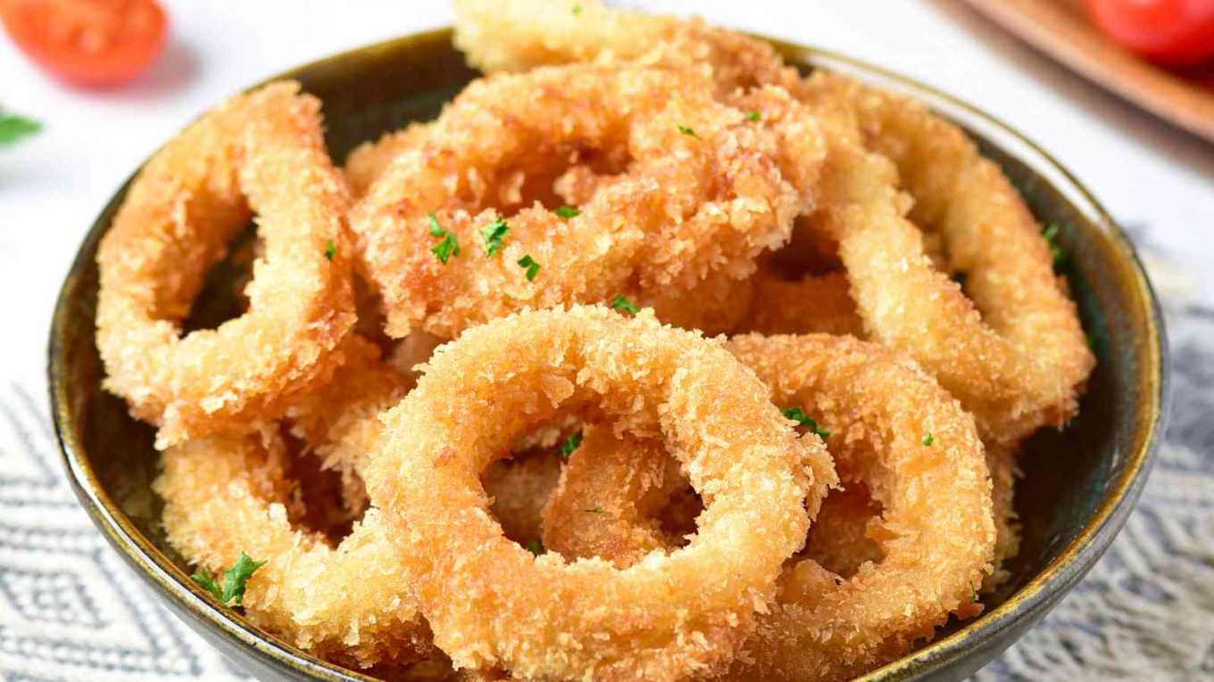 Lightly battered calamari rings and onion rings fried to golden perfection, served with lemon wedges
