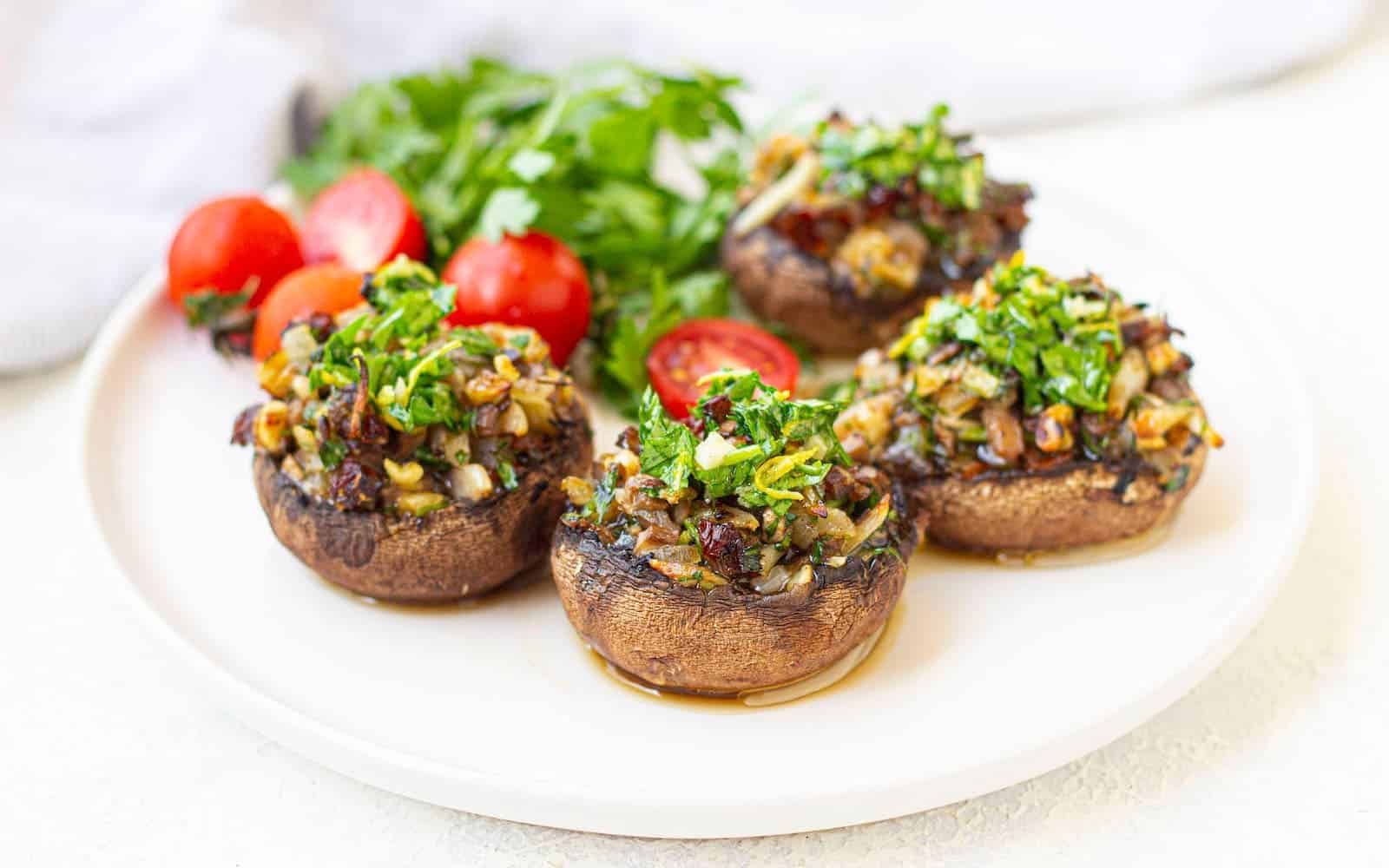 Baked cremini mushrooms filled with herb‑infused cream cheese, garnished with parsley