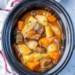 Rich beef stew with tender chunks of meat, potatoes, carrots, and a thick brown gravy