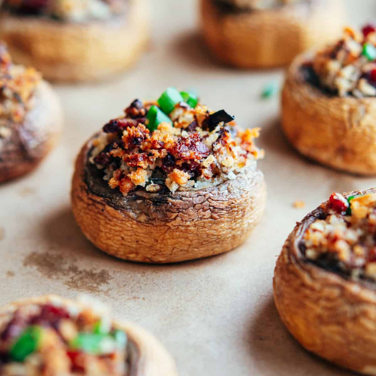 Baked mushroom caps filled with garlicky herb cheese, garnished with parsley