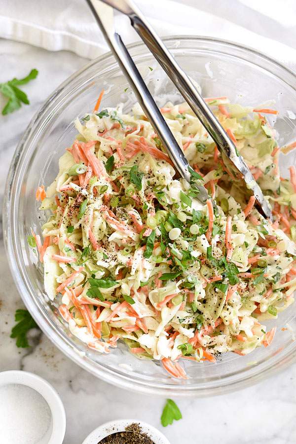 Tangy buttermilk creamy coleslaw featuring crisp cabbage, zesty dressing, and vibrant cool crunch.