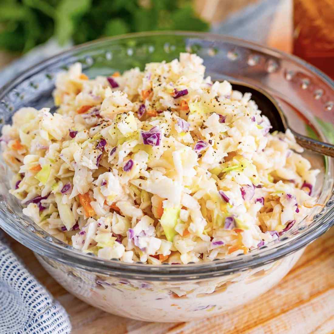 Southern coleslaw featuring crisp shredded green cabbage in sweet tangy buttermilk dressing