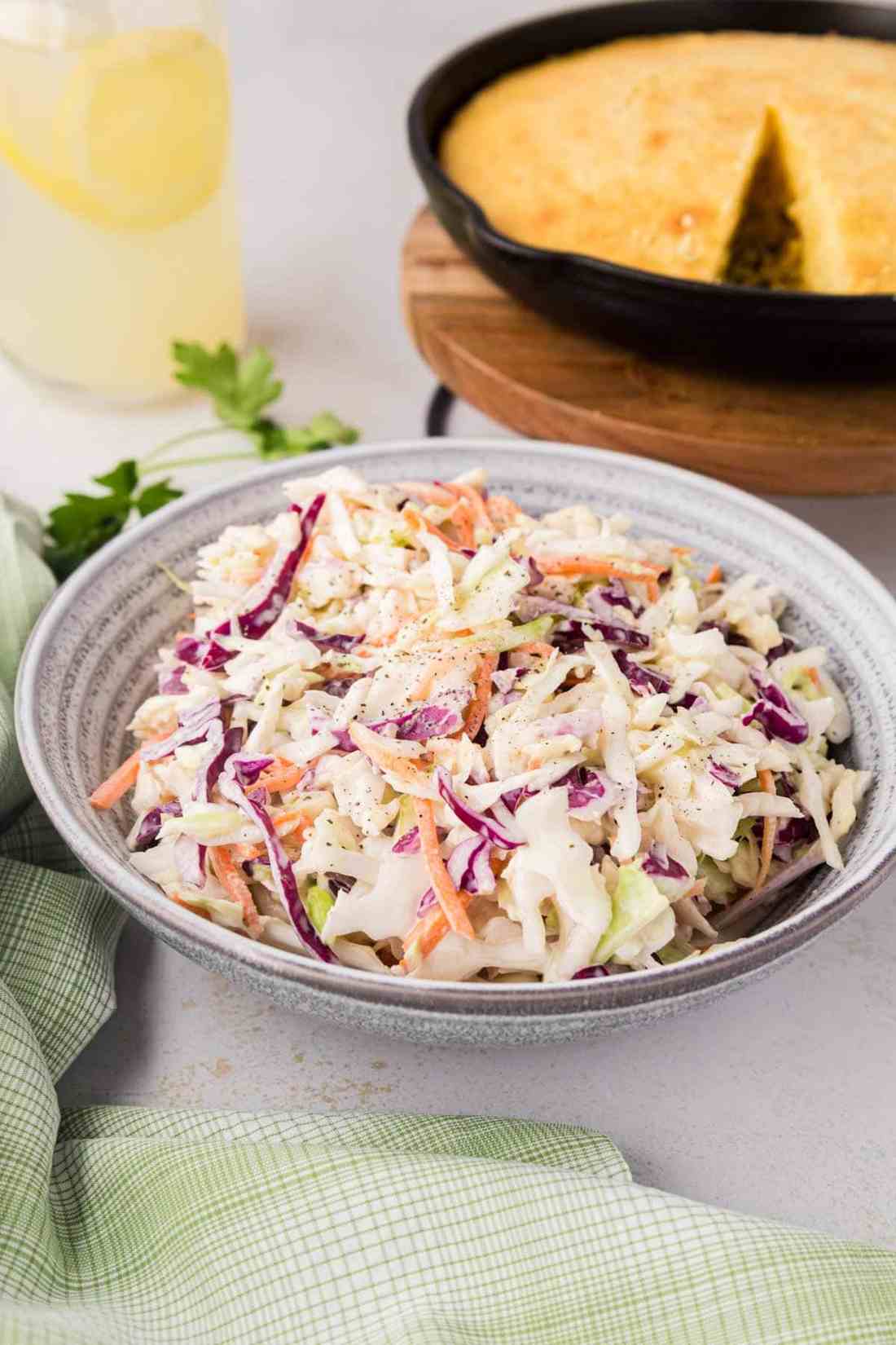 Classic creamy coleslaw with crisp green and red cabbage tossed in velvety rich dressing