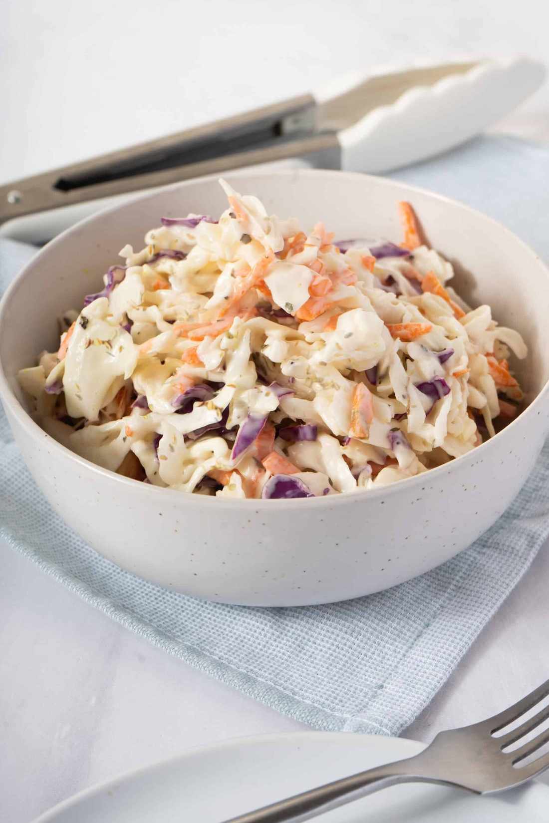 Sweet‑cream Southern coleslaw with crisp cabbage, golden mayo, and honey‑kissed carrots