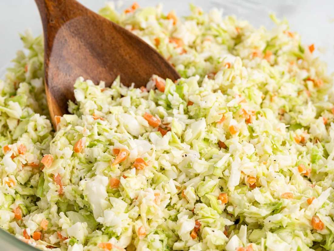 Southern KFC coleslaw with creamy mayo, tangy vinegar, crisp cabbage, and sweet carrot ribbons