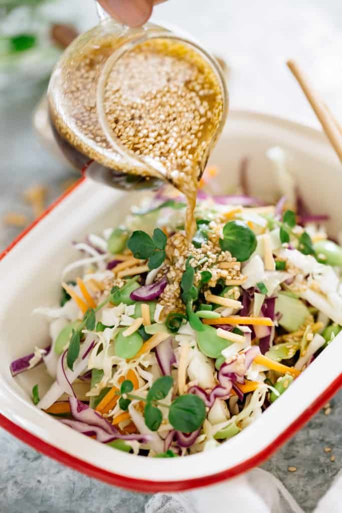 Sweet‑heat Asian slaw with crunchy cabbage, chili‑sesame dressing, and vibrant cilantro