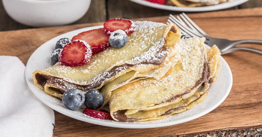Thin chocolate crepes with Nutella spread, topped with melted chocolate and a sprinkle of sea salt