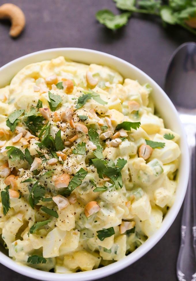 Curried egg salad with chopped hard-boiled eggs, creamy mayo, cilantro, and a hint of lemon