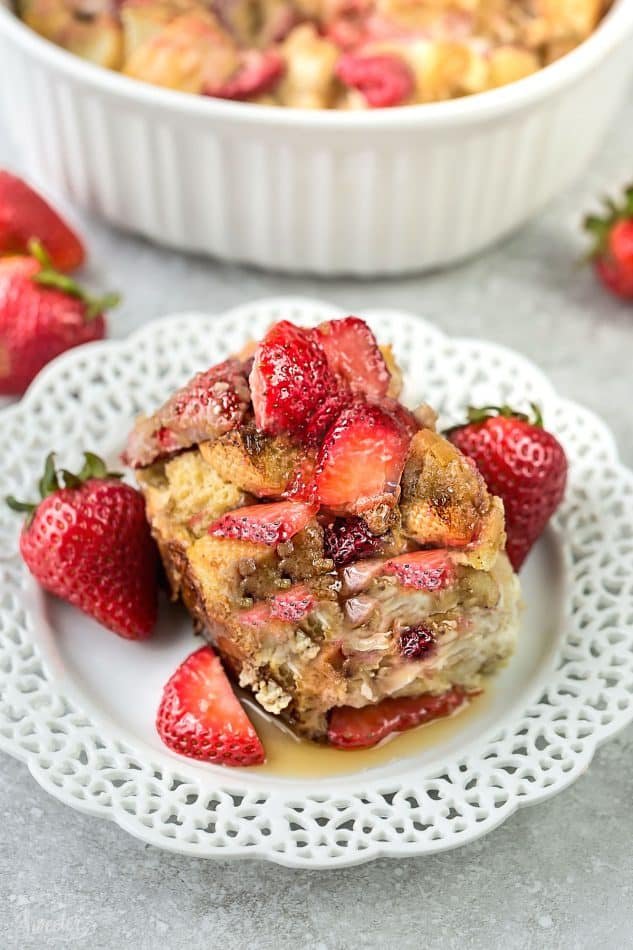 Golden custardy bread cubes topped with warm strawberry compote, drizzled with maple syrup