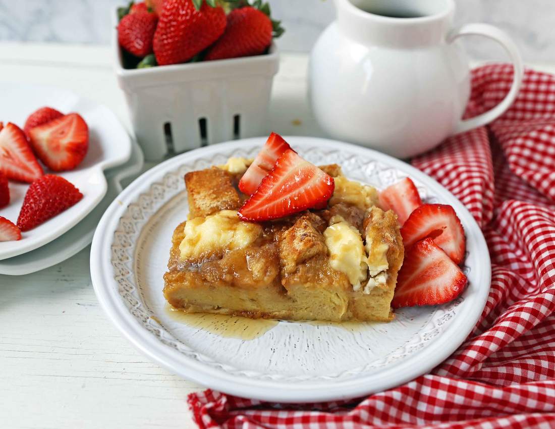 Golden custardy bread cubes in a maple-syrup French toast casserole, steaming and inviting
