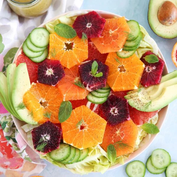 Autumn fresh fruit salad with apples, pears, grapes, and a warm cinnamon‑maple glaze