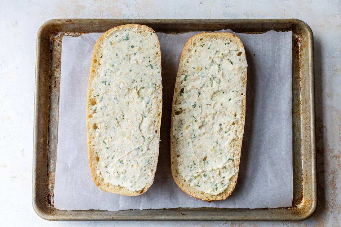 Classic garlic bread with golden crust, melted butter, aromatic garlic, and fresh parsley