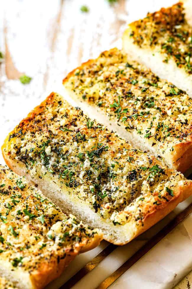 Classic garlic bread with golden crust, buttery garlic, melted mozzarella, and parsley