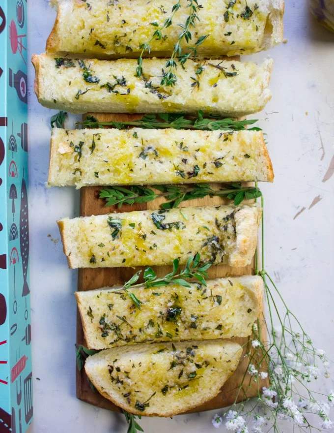 Classic garlic bread with golden crust, buttery garlic, melted mozzarella, and parsley garnish