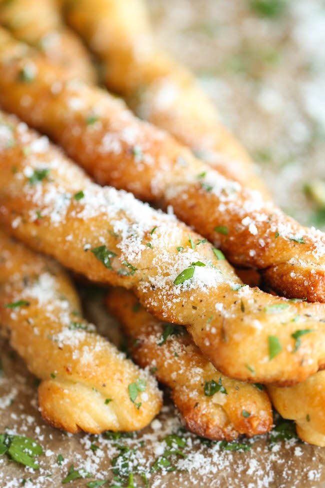 Classic garlic bread with golden buttery crust, melted cheese, garlic and fresh herbs