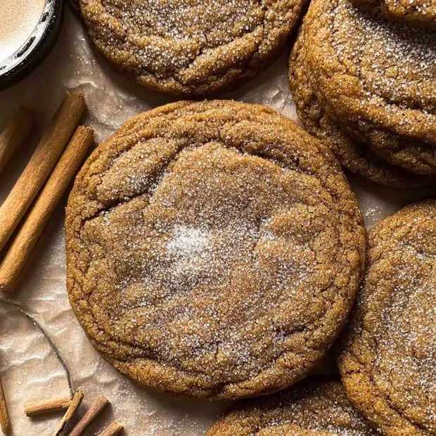 Giant sugar-dusted gingerbread cookie, warm spices, sweet glaze, festive centerpiece