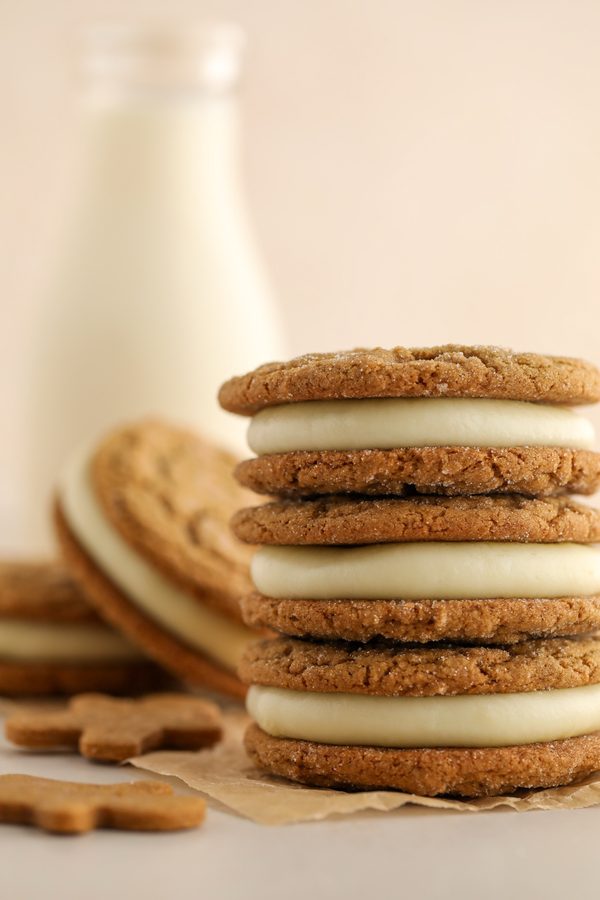 Soft gingerbread whoopie pies with creamy milk frosting, warm spices, festive holiday look