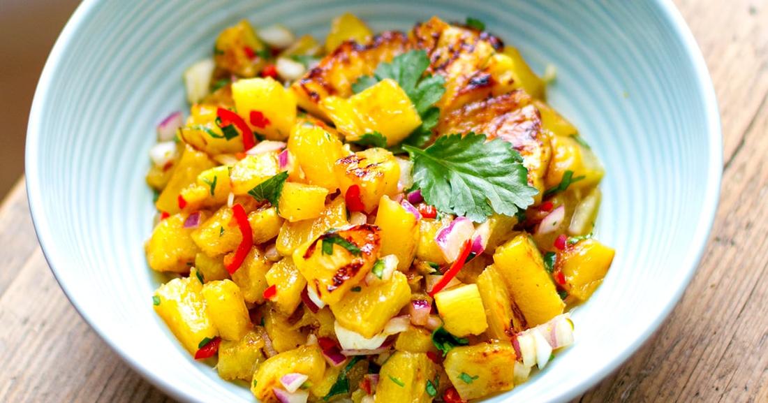Grilled pineapple salsa with crisp broccoli, tangy dressing, toasted nuts, dried fruit, and cheese.