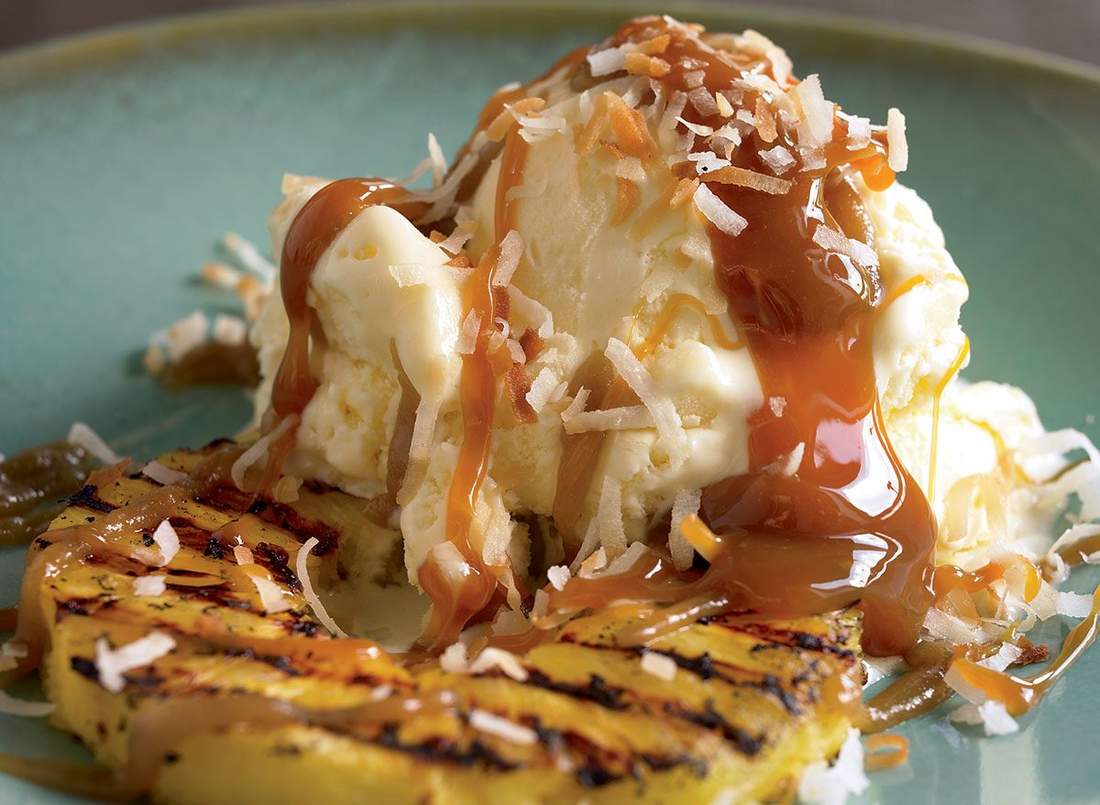 grilled pineapple rings with crisp broccoli florets, nuts, dried fruit, cheese, and savory dressing