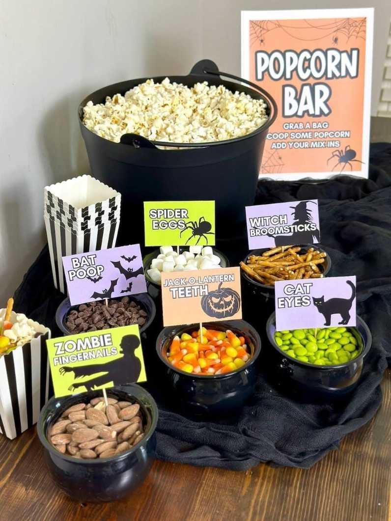 A bowl of popcorn with Halloween-themed mix-ins like candy corn and pretzels.