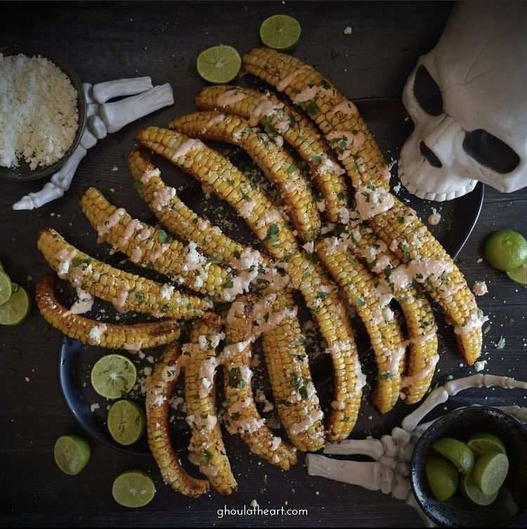 Corn on the cob cut into rib shapes and topped with lime crema and chili powder