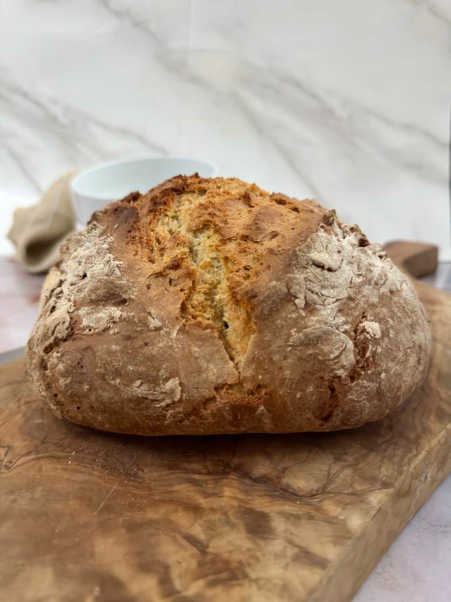 Simple 4‑ingredient soda bread loaf with a golden crust and soft interior