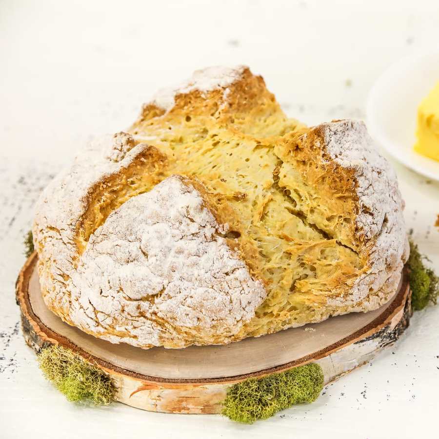 Simple golden Irish soda bread loaf with fluffy interior and rustic crust