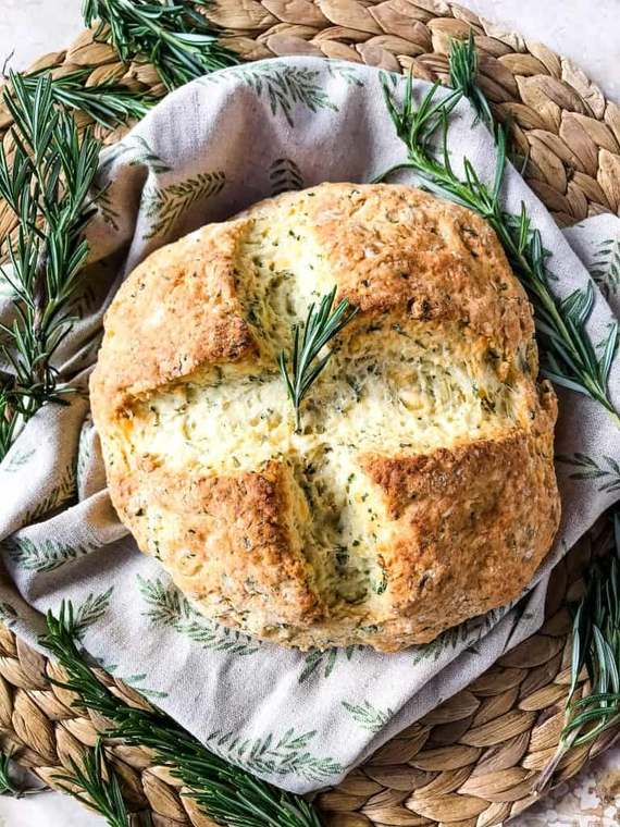 Mini Irish soda bread loaves packed with herbs, cheddar, golden crust
