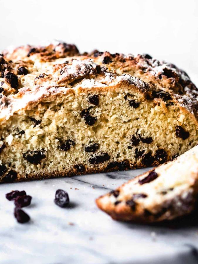 Sweet Irish soda bread with golden crust and plump raisin pockets